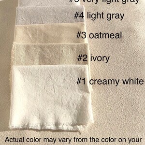 May include: Five fabric swatches in various shades of white and gray, labeled #5 very light gray, #4 light gray, #3 oatmeal, #2 ivory, and #1 creamy white. The text "Actual color may vary from the color on your screen to monitor color restrictions" is below the swatches.