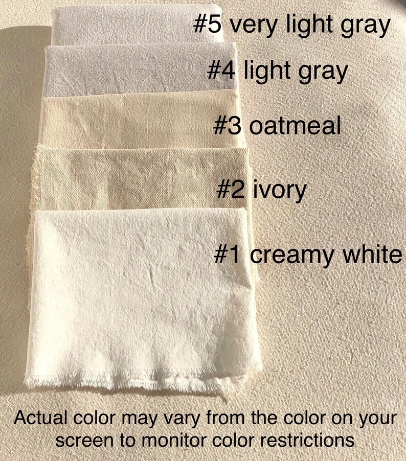 May include: Five fabric swatches in various shades of white and gray, labeled #5 very light gray, #4 light gray, #3 oatmeal, #2 ivory, and #1 creamy white. The text "Actual color may vary from the color on your screen to monitor color restrictions" is below the swatches.