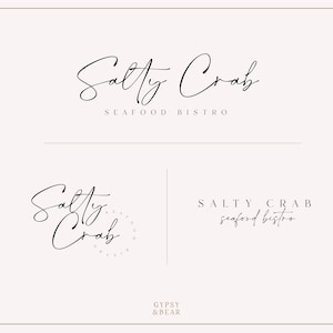 May include: A logo design for a seafood bistro called "Salty Crab". The logo features a handwritten font and the words "Seafood Bistro" in a smaller font below the name.