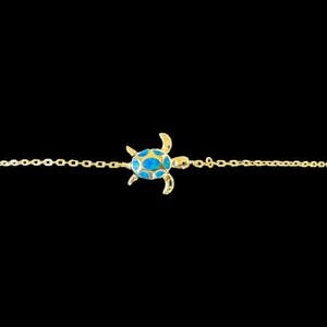 May include: A gold chain bracelet with a blue enamel turtle charm.