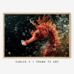 May include: A vibrant orange seahorse swims in dark water, surrounded by bubbles. The seahorse has a long snout and a spiky dorsal fin. The artwork is framed in a light wood frame. Text at the bottom reads "CARLOS V | FRAME TV ART."