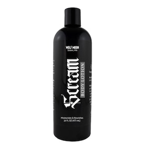 May include: A black bottle of body lotion with a white label that says "Scream" in a gothic font. The label also says "Body Lotion" and "Moisturizes & Nourishes" and lists the size as "36 fl oz (473 ml)".