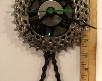 Recycled bike parts clock with pendelum