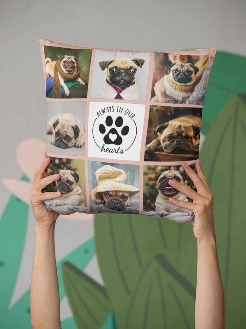 May include: Square decorative pillow featuring a collage of pug dog portraits. The pillow has a pink border and includes the text "ALWAYS IN OUR hearts" with a paw print and heart design. The pugs are wearing various accessories.