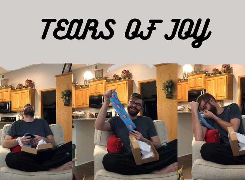 May include: A person is sitting on a couch and holding a pair of socks with a face printed on them. The person is laughing and appears to be very happy. The text "Tears of Joy" is written above the image.