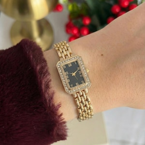 Vintage Style Women’s rectangular gold tone bracelet watch with black dial and crystal bezel