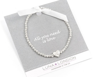 Heart stretch bracelet - All you need is love! A stretch bracelet on gift card with printed message area