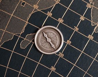 Compass pocket metal travel token with Stay Safe on your travels on reverse
