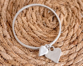 Tin Anniversary bangle with a duo of pewter hearts to celebrate 10 years of marriage