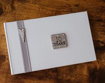 10 Years (Tin Anniversary) Photo Album with a stylish grey stitched ribbon & heart detail