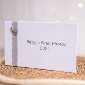Baby&#39;s Scan Photo album 2024 - White with grey/pink/blue stitched ribbon & footprints