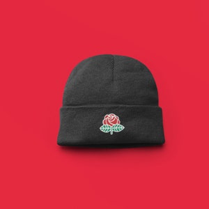 May include: A set of three ceramic mugs with a speckled, matte finish. The mugs are in shades of cream, light gray, and dark gray. Each mug has a simple, minimalist design and a rounded handle.