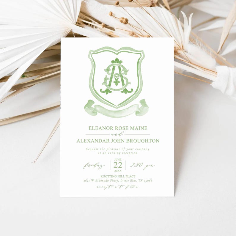 May include: A white invitation card with a green crest design. The crest features intertwined initials and a banner. The text includes names, a date, time, and location for an evening reception. The card is decorated with a watercolor style.
