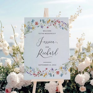 May include: A wedding welcome sign with a floral border. The sign reads "Welcome to the wedding of Jessica and Richard, September 14, 2022".