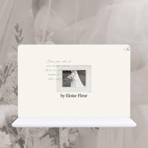 May include: A white laptop computer with a website open on the screen. The website features a black and white photo of a bride in a wedding dress holding a bouquet of flowers. The text "by Eloise Fleur" is displayed below the photo.