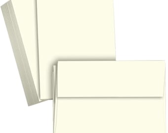 May include: A stack of ivory-colored card stock paper. The paper is smooth and has a slightly textured finish.