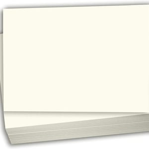May include: A stack of blank white card stock paper.