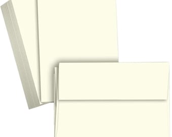 May include: A stack of ivory card stock paper with a stack of ivory envelopes.