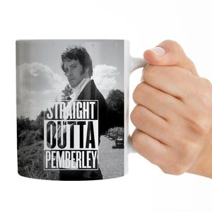 May include: White ceramic mug with a black and white image of a man in a suit and the text "Straight Outta Pemberley".