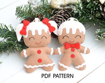 May include: Two felt gingerbread people ornaments, one with red bows and the other with a red bow tie.  The ornaments are white, brown, and red.  The text "PDF PATTERN" is printed below the ornaments.