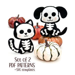 May include: Two plush Halloween skeleton toys, a cat and a dog, sit atop pumpkins. The cat is black and white, with a skeleton design. The dog has black ears and a skeleton design. The text "Set of 2 PDF Patterns + SVG templates" is below.