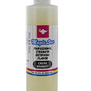 May include: A bottle of Magic Line Creme Bouquet artificial flavor. The label features a pink square with a lamp graphic, the brand name, and the text "PROFESSIONAL STRENGTH ARTIFICIAL FLAVOR". The bottle contains 8 fl oz (236.56 mL) of product.