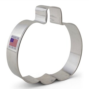 May include: A silver metal pumpkin cookie cutter. The cutter has a simple design and is made in the USA.