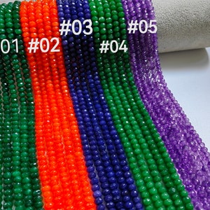 May include: Five strands of faceted gemstone beads, labeled #01 through #05. The beads are green, orange, blue, green, and purple.