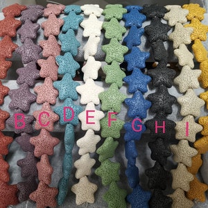 May include: Ten strands of lava rock beads in various colors, including red, purple, blue, white, green, black, and yellow. Each strand features star-shaped beads.