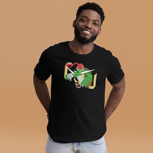Könnte beinhalten: Schwarzes T-Shirt mit einer Grafik einer grünen Schildkröte mit roter Maske, die eine Waffe hält. Das Design ist von einer gelben Kontur umrahmt. Das T-Shirt wird von einer Person getragen.