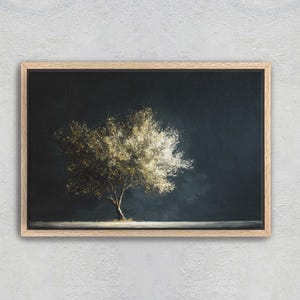 May include: A framed art print featuring a tree with a full, textured crown, set against a dark, moody background. The tree's foliage is a mix of light and dark tones, creating a sense of depth and contrast. The frame is a light wood color.