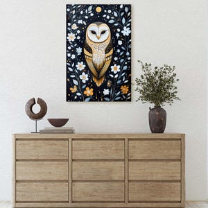 May include: A painting of a barn owl with golden feathers and white markings, perched in a dark woodland setting with white and yellow flowers. The owl has a serious expression and is looking directly at the viewer.