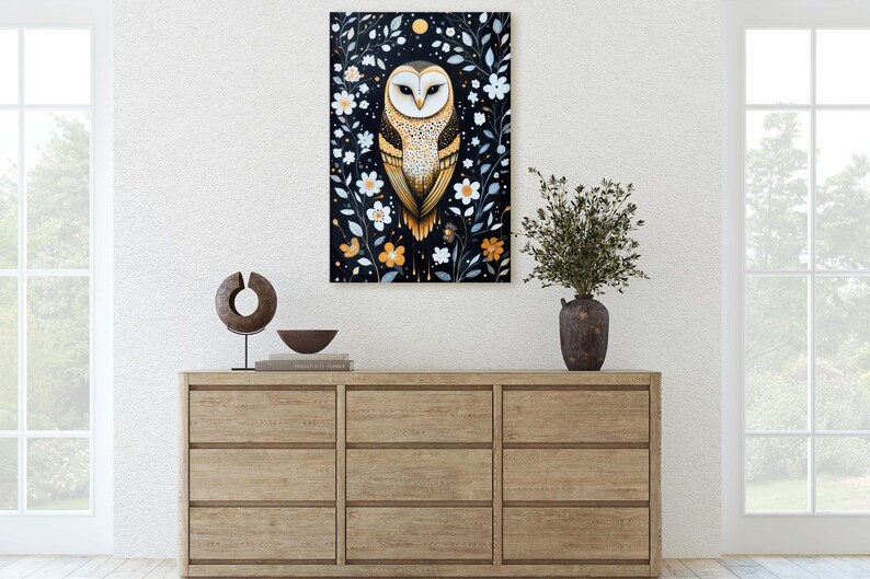 May include: A painting of a barn owl with golden feathers and white markings, perched in a dark woodland setting with white and yellow flowers. The owl has a serious expression and is looking directly at the viewer.