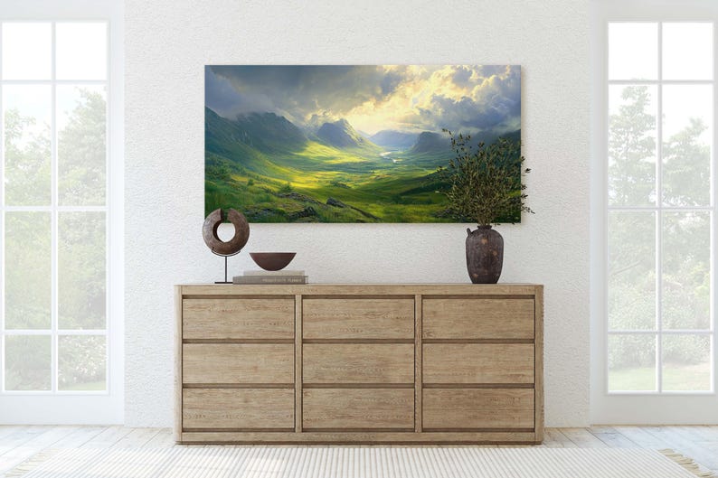 May include: A wooden dresser with six drawers, a brown ceramic vase with dried flowers, a wooden sculpture, and a bowl on top. A large landscape painting of a valley with mountains and clouds hangs above the dresser.