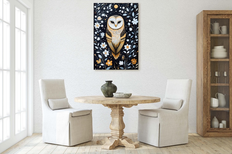 May include: A white owl with yellow eyes and brown markings sits in a frame of white flowers and green leaves on a black background.