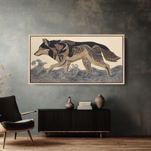 May include: A framed artwork depicts a wolf walking through stylized blue waves. The wolf is rendered in shades of brown, black, and tan with intricate patterns. The artwork is displayed in a room with a dark gray wall and a black cabinet.