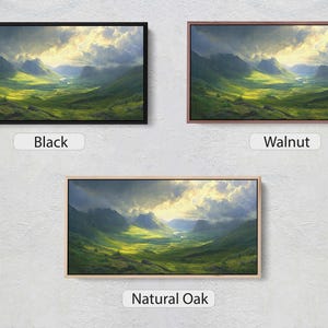 May include: Three different frame options for a picture of a green valley with mountains in the background. The frame options are black, walnut, and natural oak.