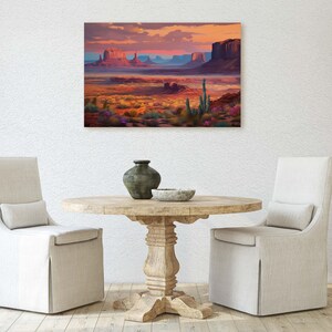 May include: A painting of a desert landscape with red rock formations, a blue sky, and a sunset. The painting is framed and hanging on a white wall above a wooden table with two chairs.
