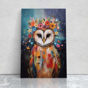 May include: A colourful painting of an owl wearing a flower crown. The owl is painted in a vibrant style with splashes of colour and texture. The background is a dark blue with hints of green and purple.
