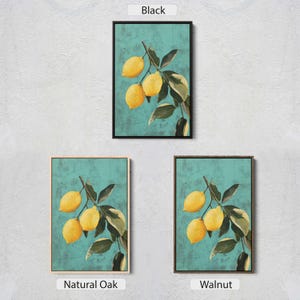 May include: A painting of a lemon branch with yellow lemons on a teal background. The painting is available in three frame colors: black, natural oak, and walnut.