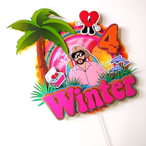 May include: A colorful cake topper featuring a cartoon illustration of a man wearing sunglasses and a hat, with the number 4. The topper includes a palm tree, dolphins, and the word "Winter" in pink letters.