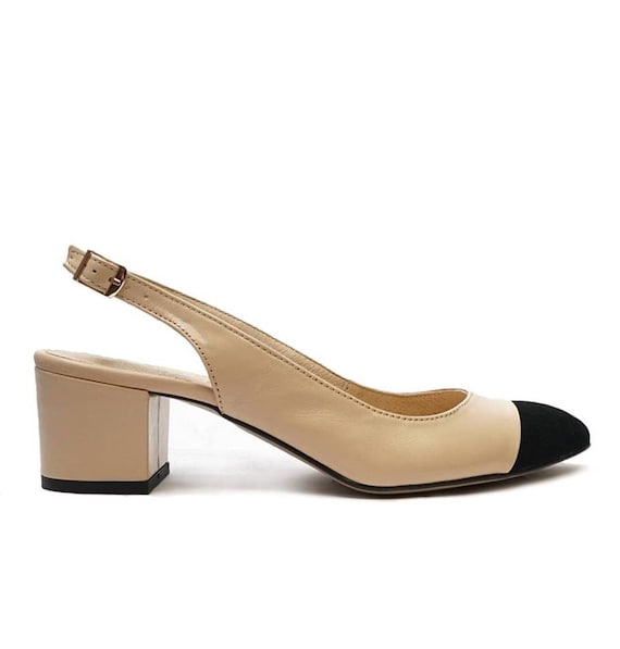 Cream and store black pumps