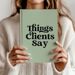May include: A sage green notebook with the text "Things Clients Say" in black retro font.