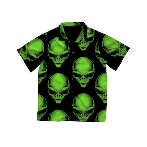 May include: Black button-down shirt with a repeating pattern of green alien faces. The short-sleeved shirt has a classic collar and button closure. The alien faces are detailed with large eyes and a smooth, rounded head.