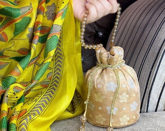 Banarasi Weaves: Camel-Colored Banarasi Cloth Potli Bag, Elegance and Tradition in One