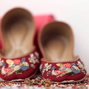 Petals & Prosperity – Embroidered Red Satin Flats | French Knot Sequin Juttis | Festive Handmade Shoes | Artistic Ethnic Footwear