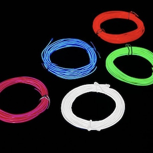 May include: Five spools of glow-in-the-dark wire in red, green, blue, pink, and white.