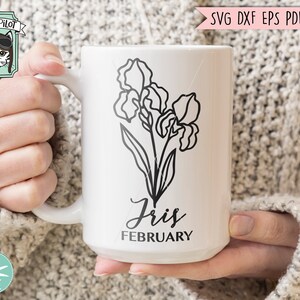 May include: White ceramic mug with a black line drawing of an iris flower and the text "Iris February".