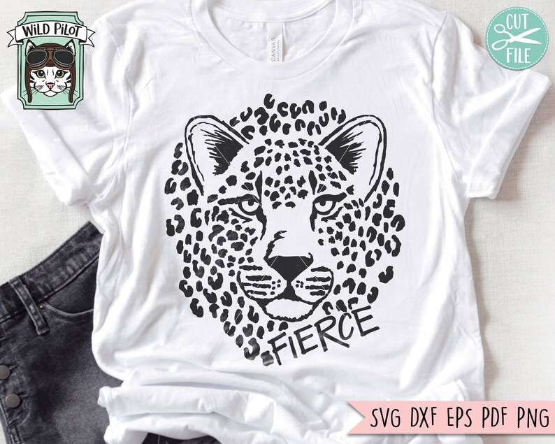 May include: Black and white graphic design of a leopard's face with the word "FIERCE" underneath. The design is on a white t-shirt.