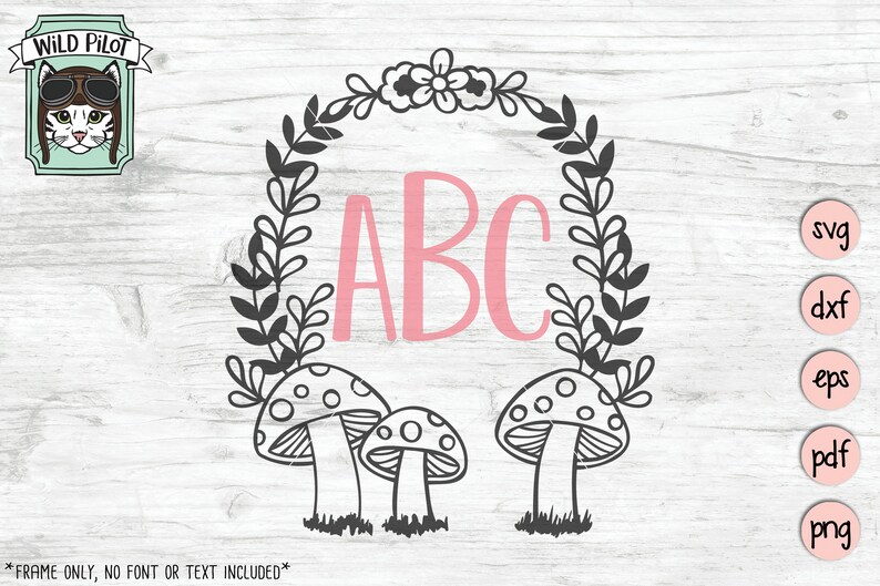 Op de afbeelding: Een zwart-witte bloemenkrans met een roze "ABC" in het midden. Drie zwart-witte paddenstoelen bevinden zich onderaan de krans.